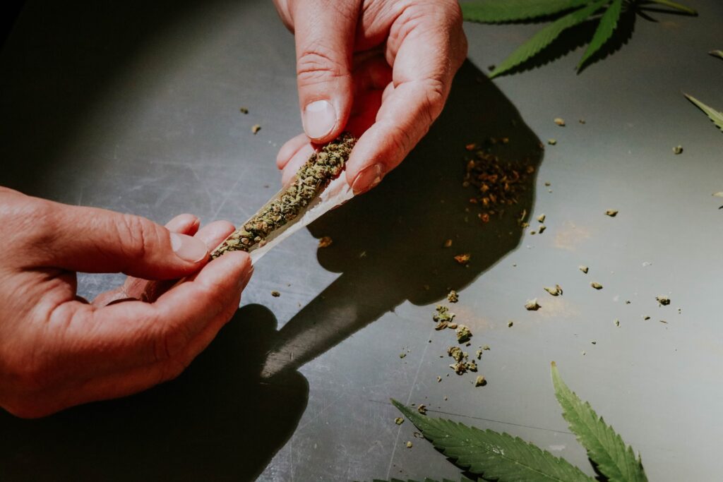 A man rolling a joint